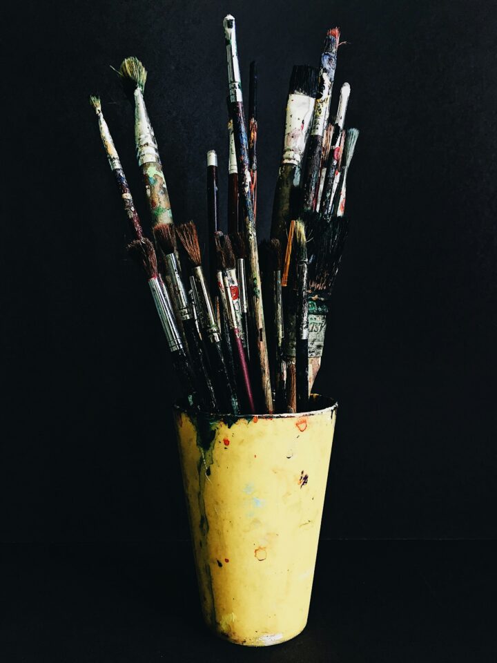 Photo by Basar Dogan on Unsplash (https://unsplash.com/photos/paint-brushes-in-yellow-plastic-cup-uVBf0tuP1gE)