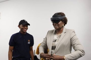 Jason Mendes with the Namibian Minister of Higher Education Ita Kandji Murangi. The Minister is wearing the Microsoft Hololens on her head.
