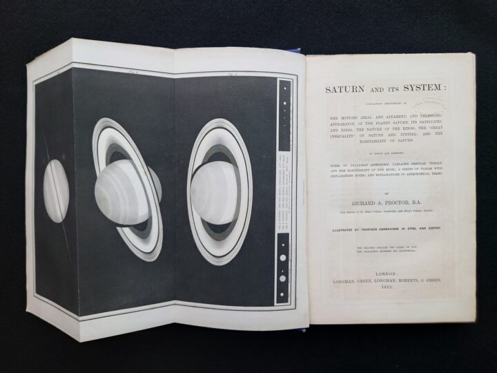 Title page of the book and an appendix page folded open presenting Saturn.