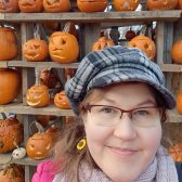 Photo of Elina Siltala smiling against a backdrop of carved pumpkins. Links to her profile at the University of Turku website.