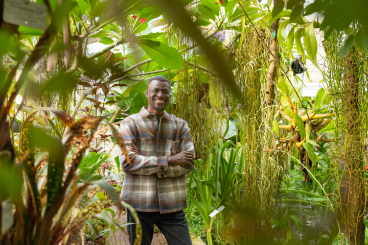 Emmanuel Kofi Dzage in the middle of tropical greenery